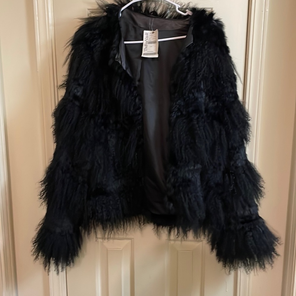 Womens Lamb and rabbit fur coat. Size large brand new.